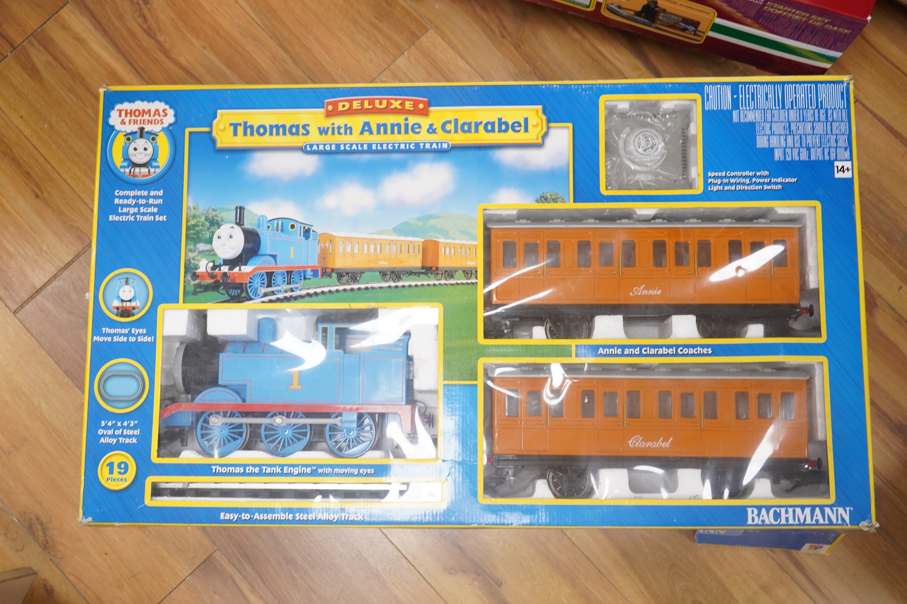 A boxed Bachmann G scale (45mm gauge) Thomas the Tank Engine train set (90068), comprising Thomas with the coaches Annie and Clarabel, track sections and controller. Condition - good, minor damage to the box.